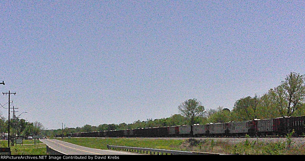 NB ballast train eases uphill to a stop.